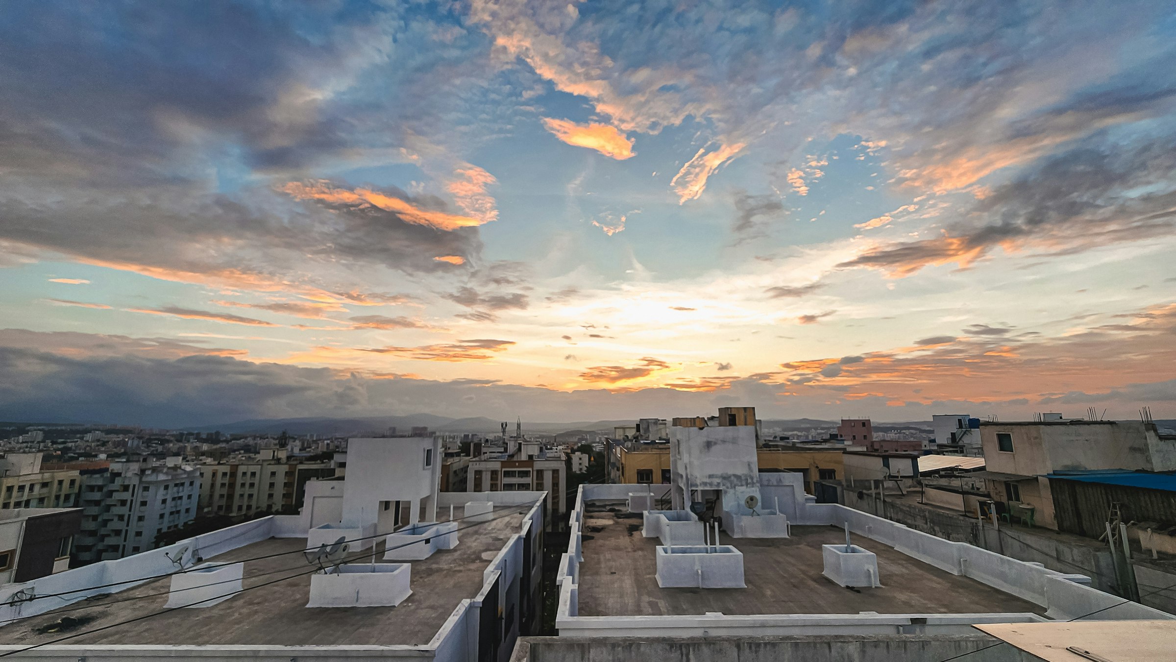 Rooftops of an Indian city at sunset