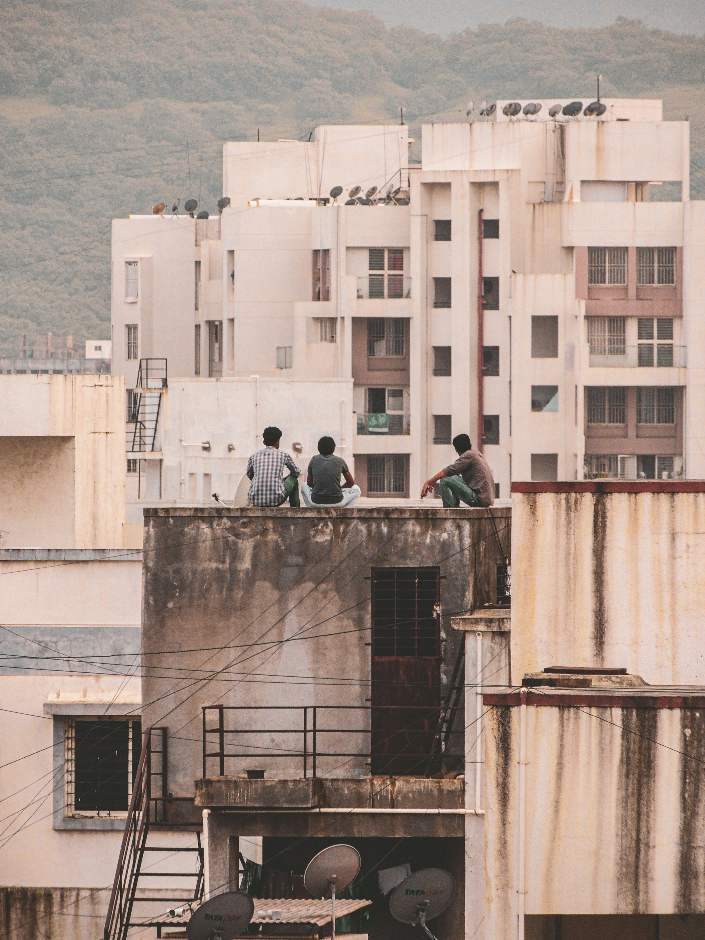 People on the roof of a concrete building