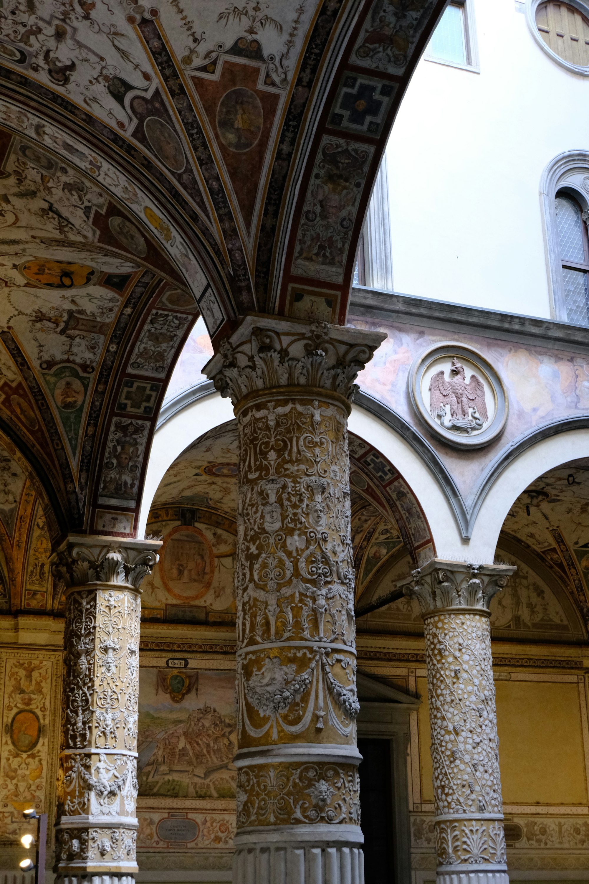A vaulted courtyard of carved stone columns